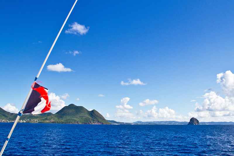 Change Of Maritime Flags With Martinique And Diamond Rock In The Background