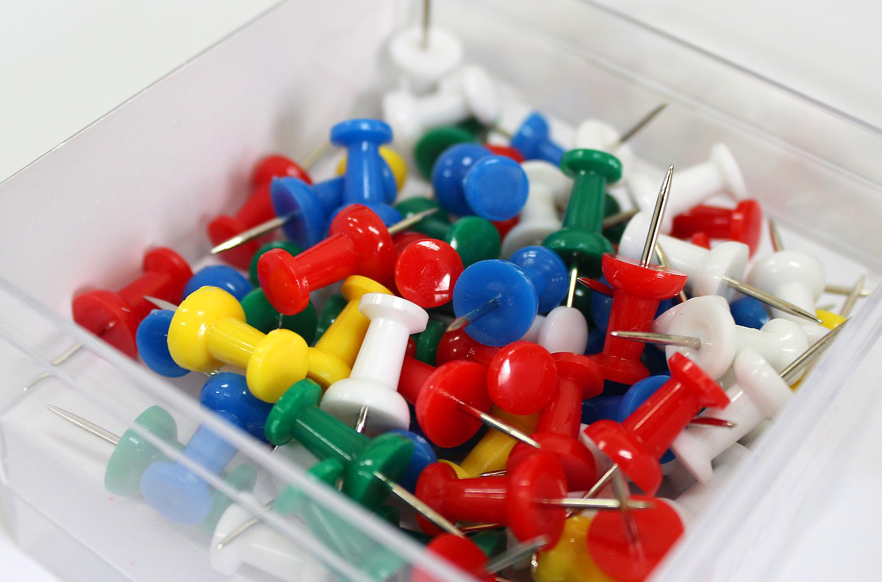 Stationary pins in plastic box